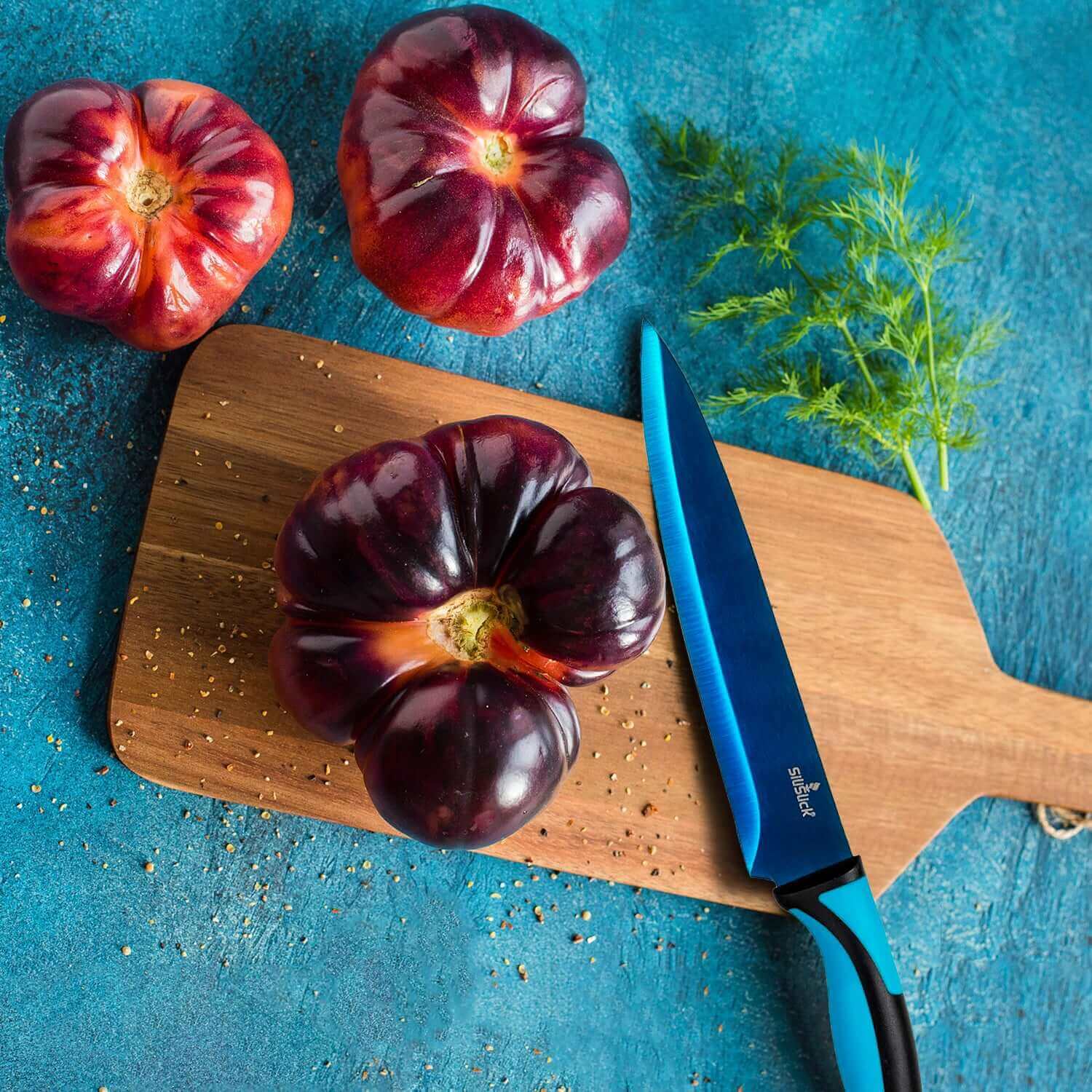 Kitchen Knife Set with Magnetic Rack displayed with fresh vegetables on a wooden cutting board.